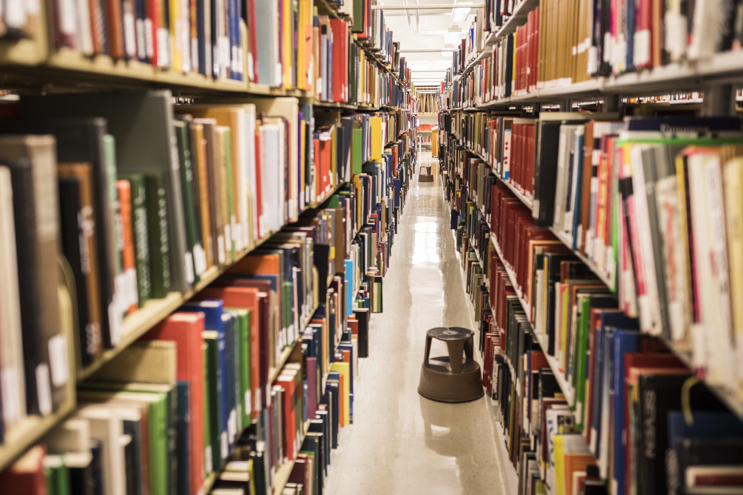 library shelves looking down the aisle